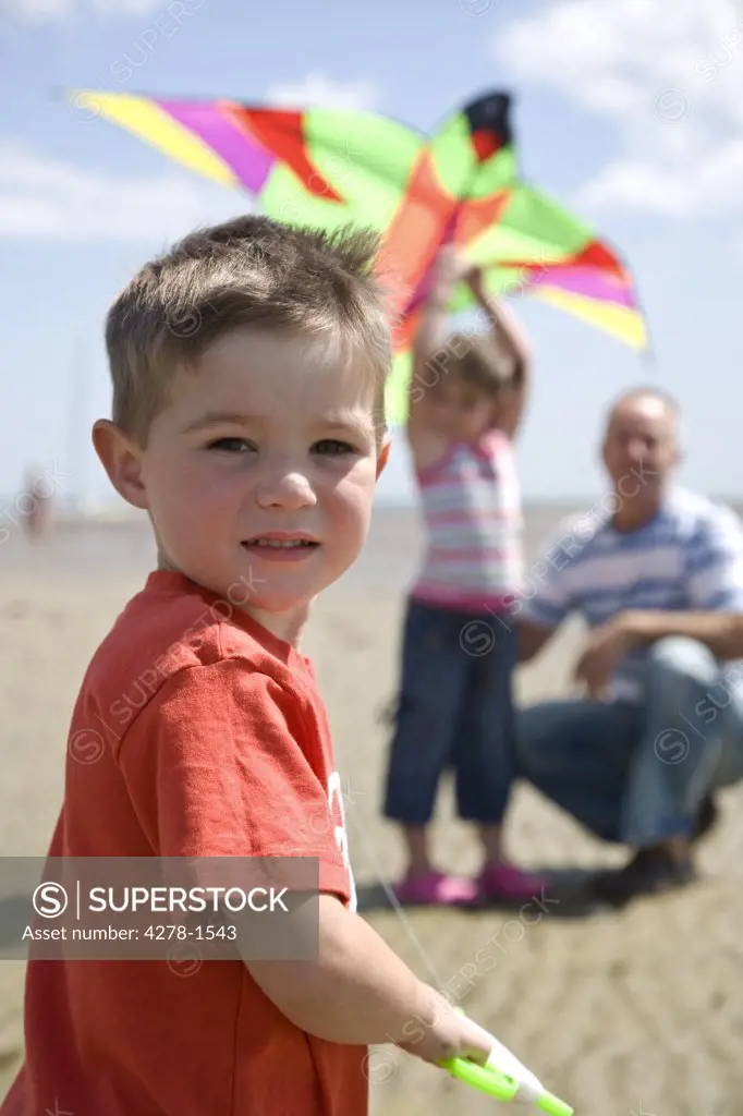 Portrait of a boy holding kite