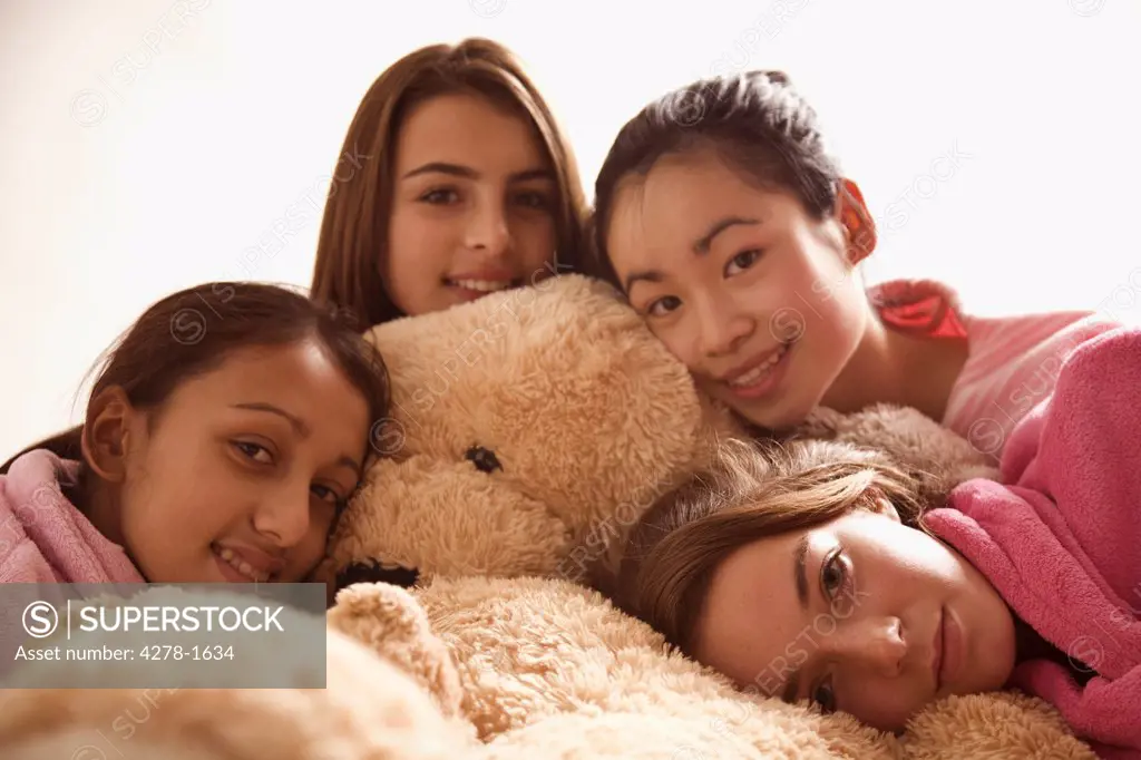 Teenage girls Hugging Teddy Bear