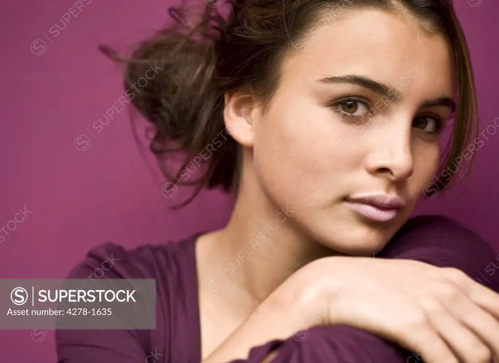 Close up of young teenager with arms crossed