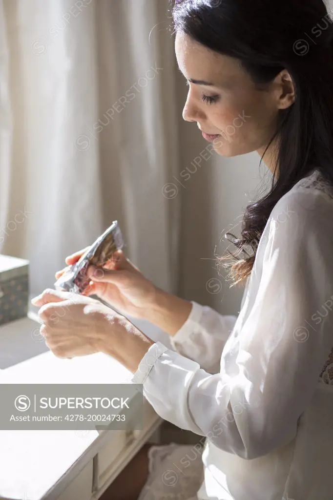 Woman Applying Hand Cream