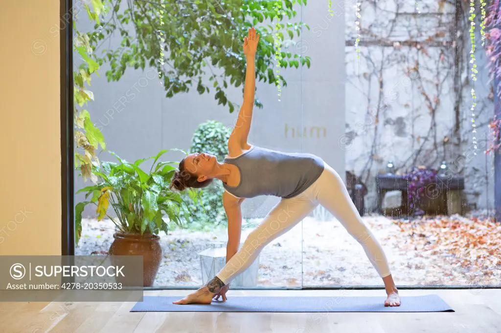 Woman Practicing Yoga, Triangle pose