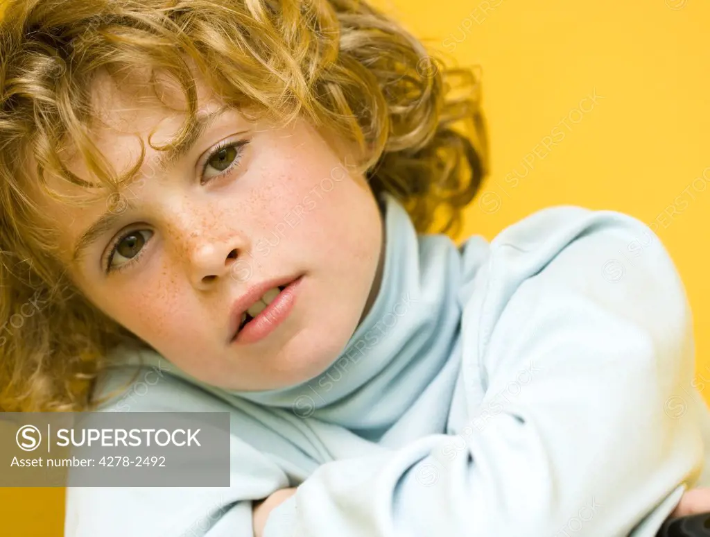 Close up of boy with curly hair