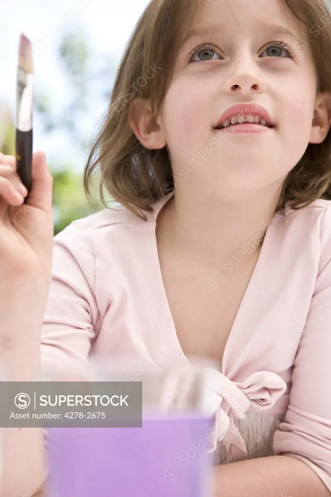 Portrait of a girl painting