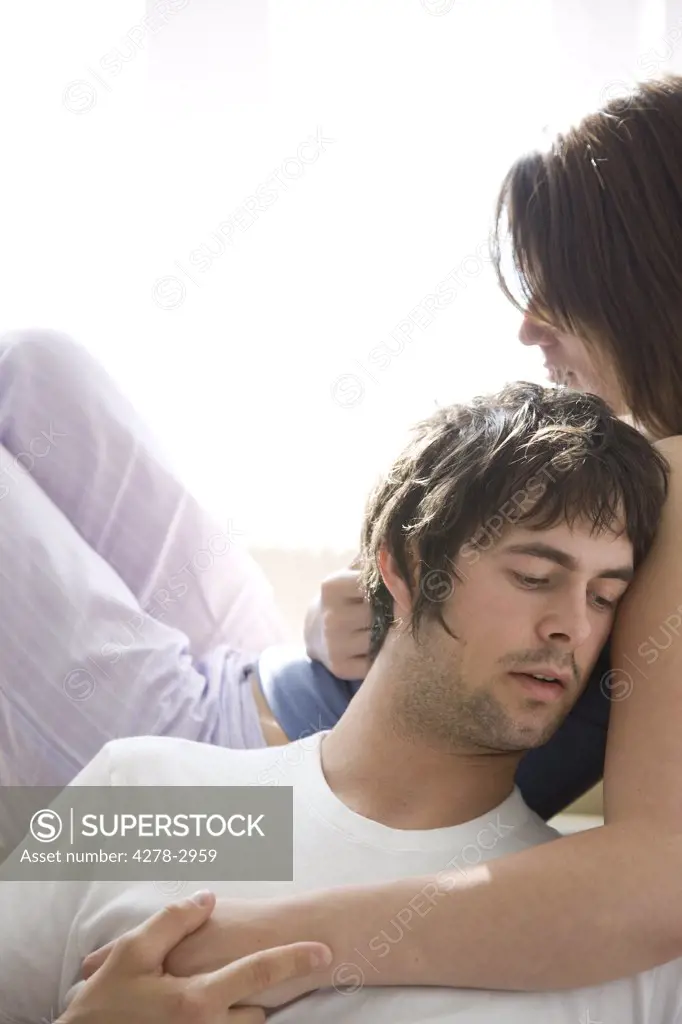 Man head leaning on woman shoulder