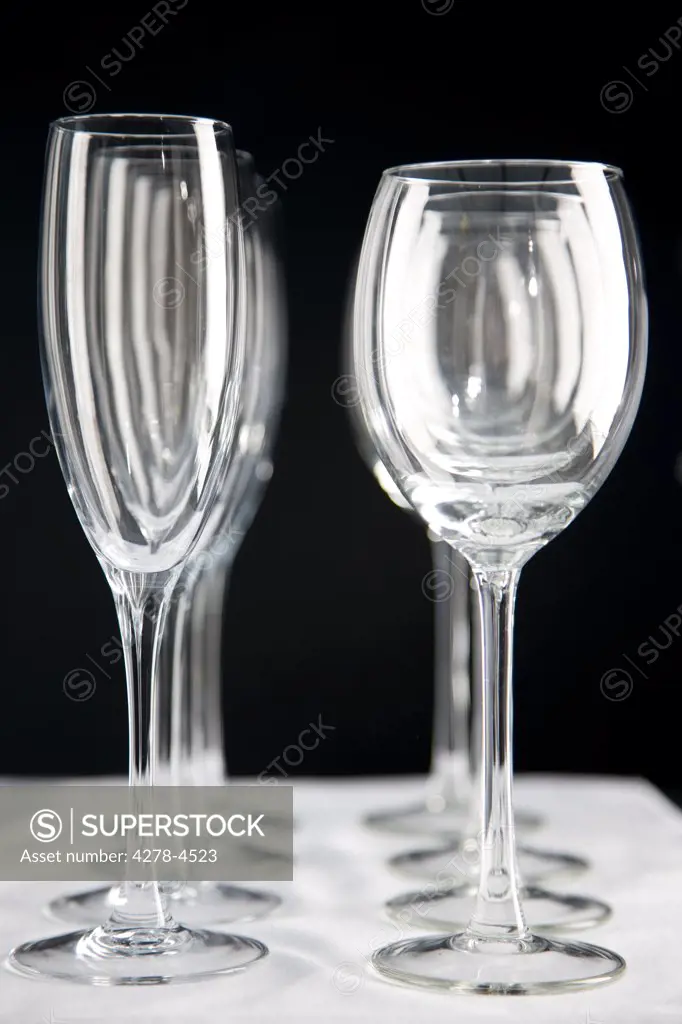 Close up of empty wine glasses lined up on a table
