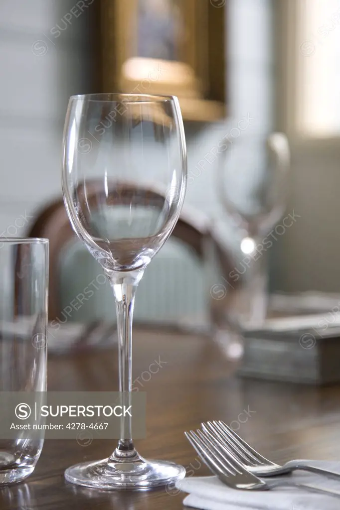 Close up of glasses on  a table in a empty restaurant dining room