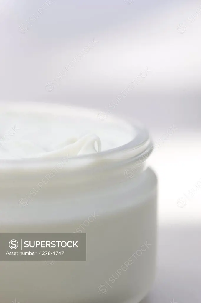 Close up of a jar full of moisturizer