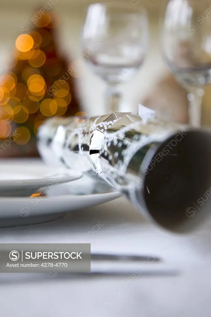 Close up of a place setting with Christmas cracker