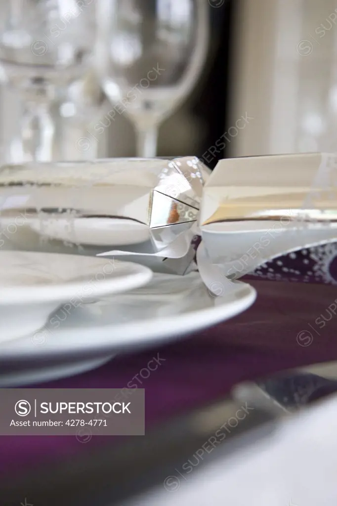 Close up of a place setting with Christmas cracker