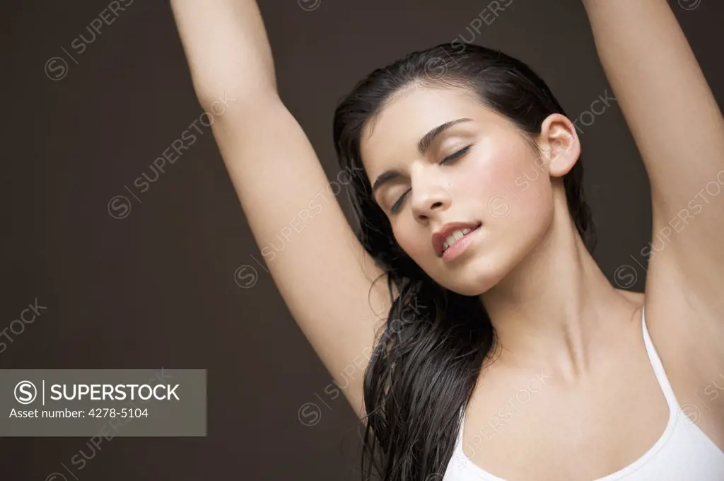 Woman with her arms stretched above her head