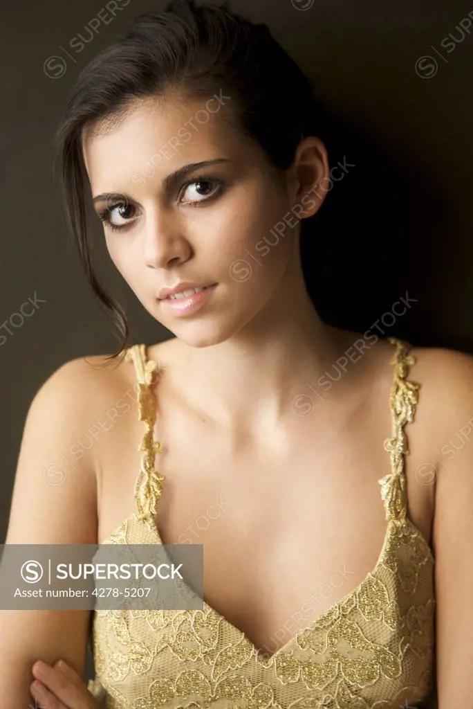 Woman wearing  a gold dress