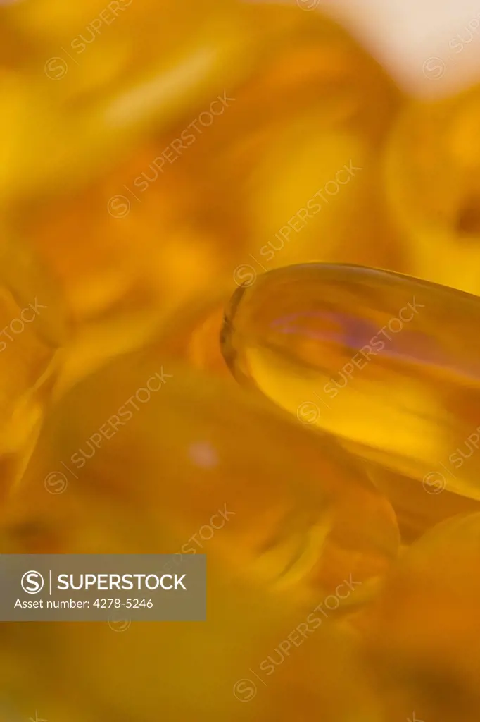 Extreme close up of cod liver oil pills