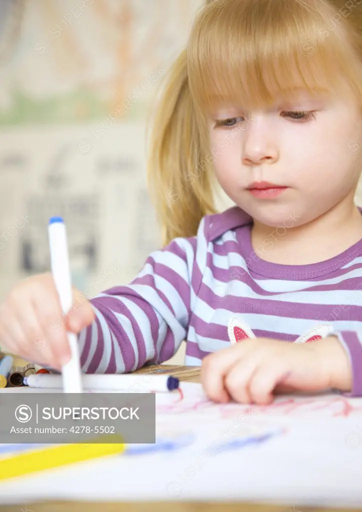 Girl drawing and coloring