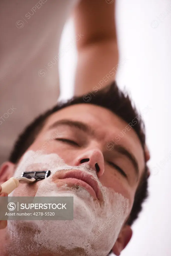Close up of a man getting a shave