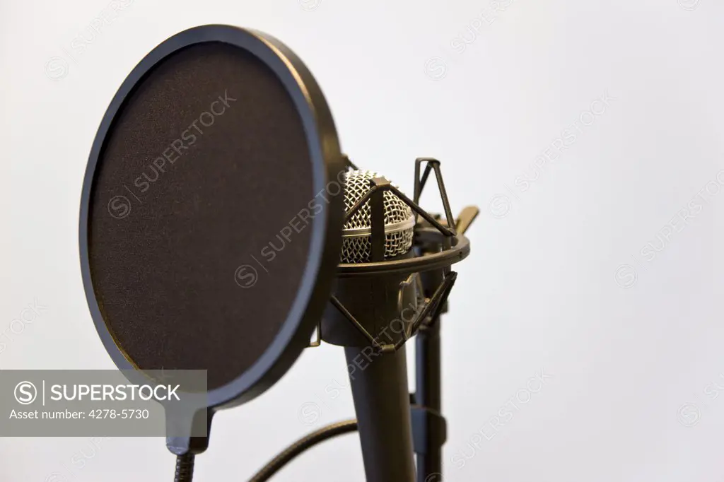Close up of a microphone and pop filter