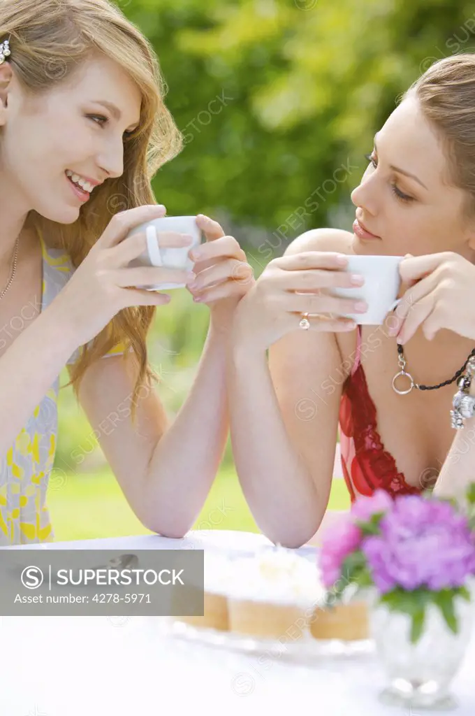 Two young women having coffee