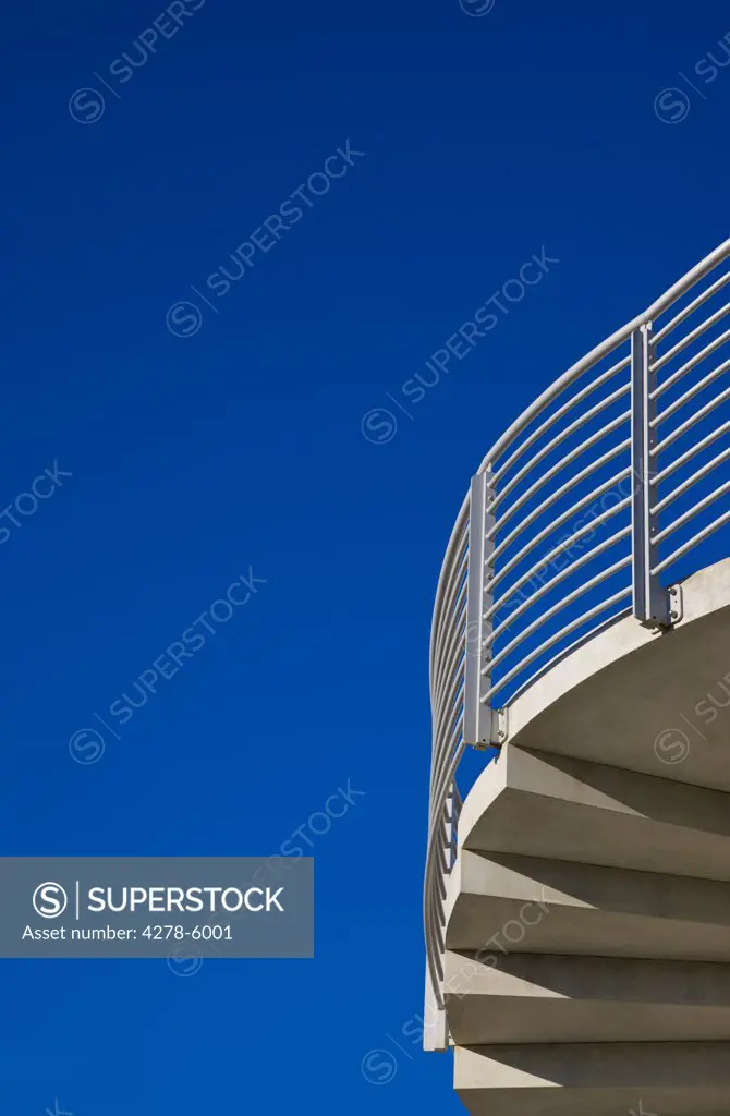 Detail of a concrete staircase against a cloudless blue sky