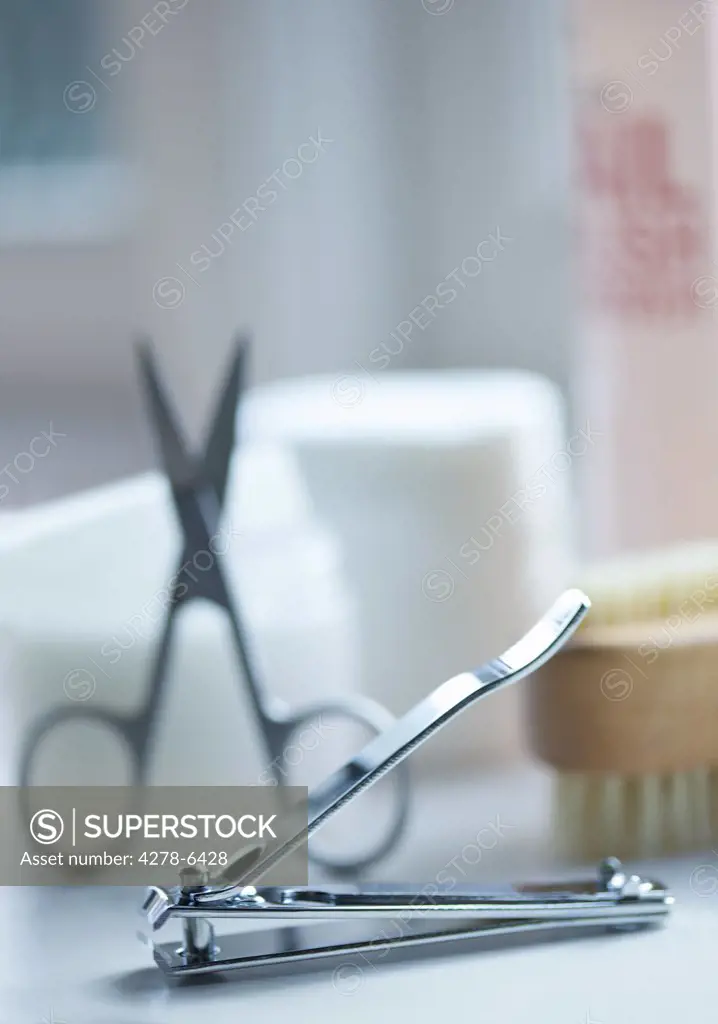 Close up of nail clippers and manicure cosmetics