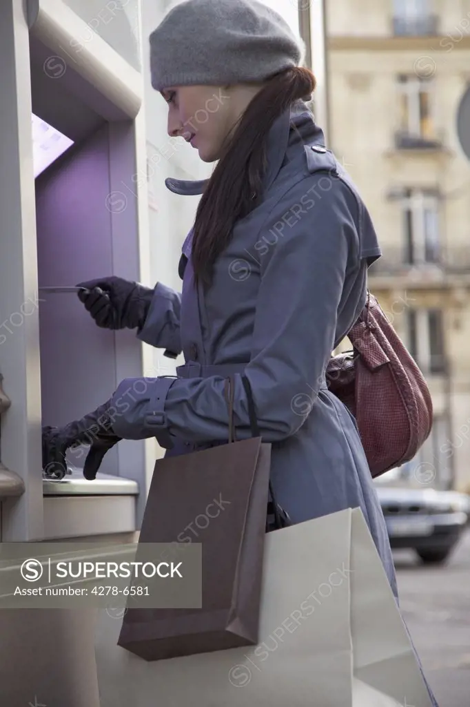 Young woman at ATM