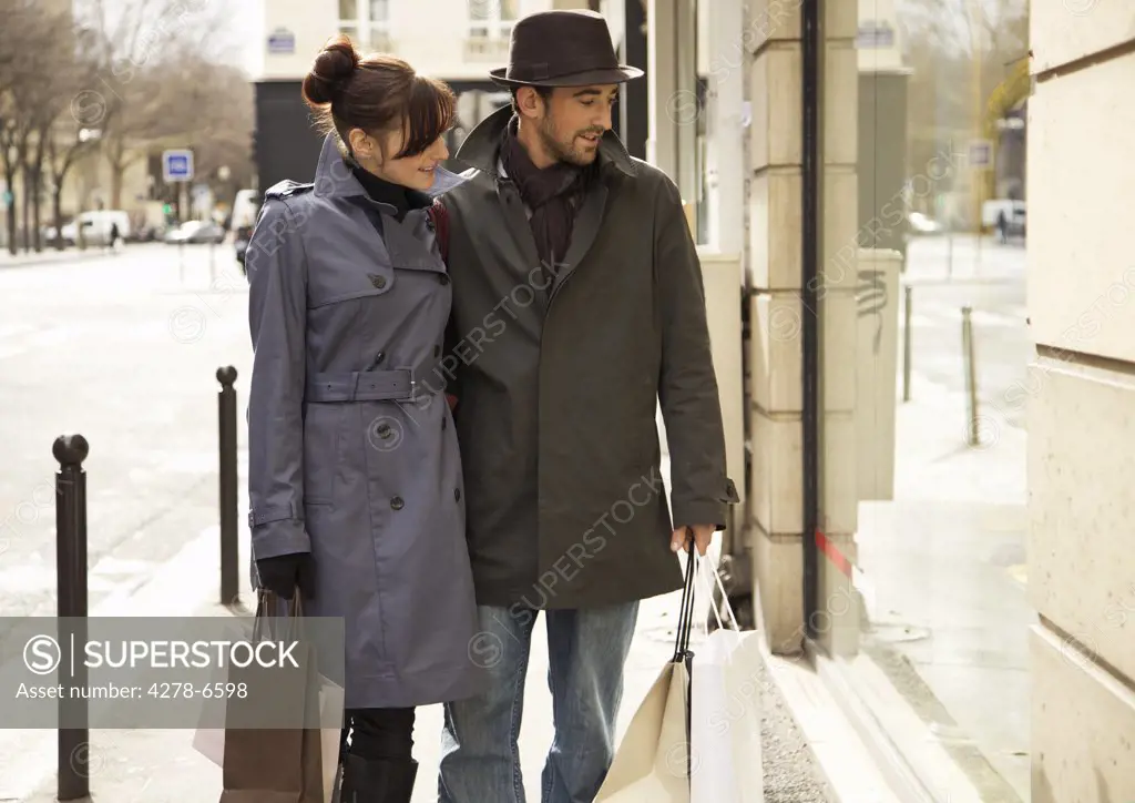 Young couple window shopping