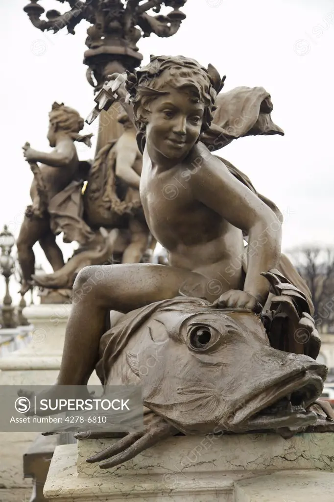 Bronze sculpture on Alexander III bridge, Paris, France