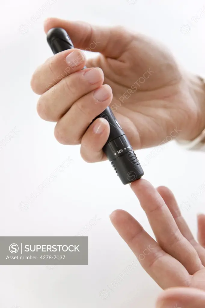 Close up of Woman's Hands Using Glucose Meter