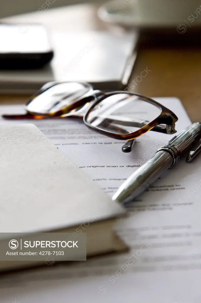 Paperwork, Eyeglasses, Notebook and Pen
