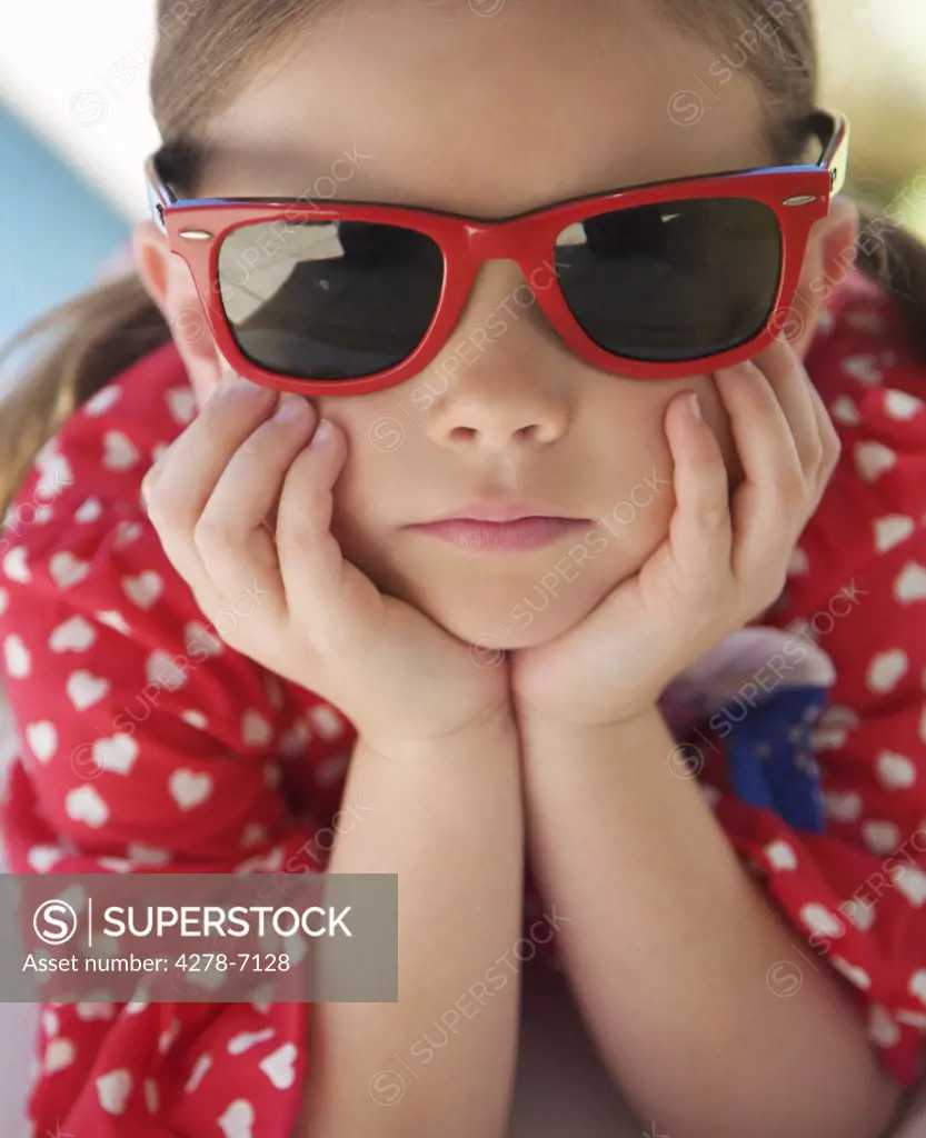 Close up of girl Wearing Red Sunglasses