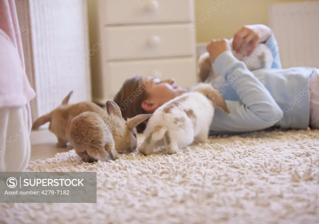 Girl Playing with Rabbits
