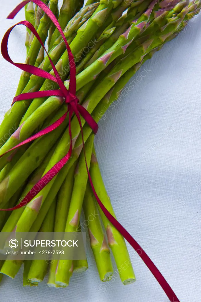 Bundle of Asparagus Tied up with Red Ribbon