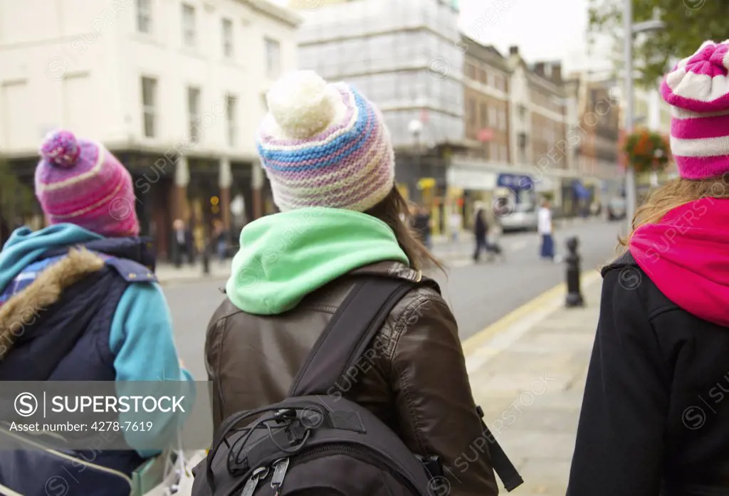 Back View of Teenage Girls Walking on a London Street