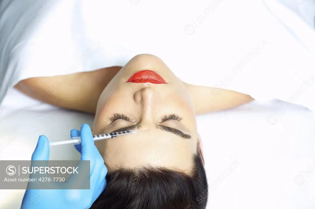 Woman Receiving Botox Injection on Forehead