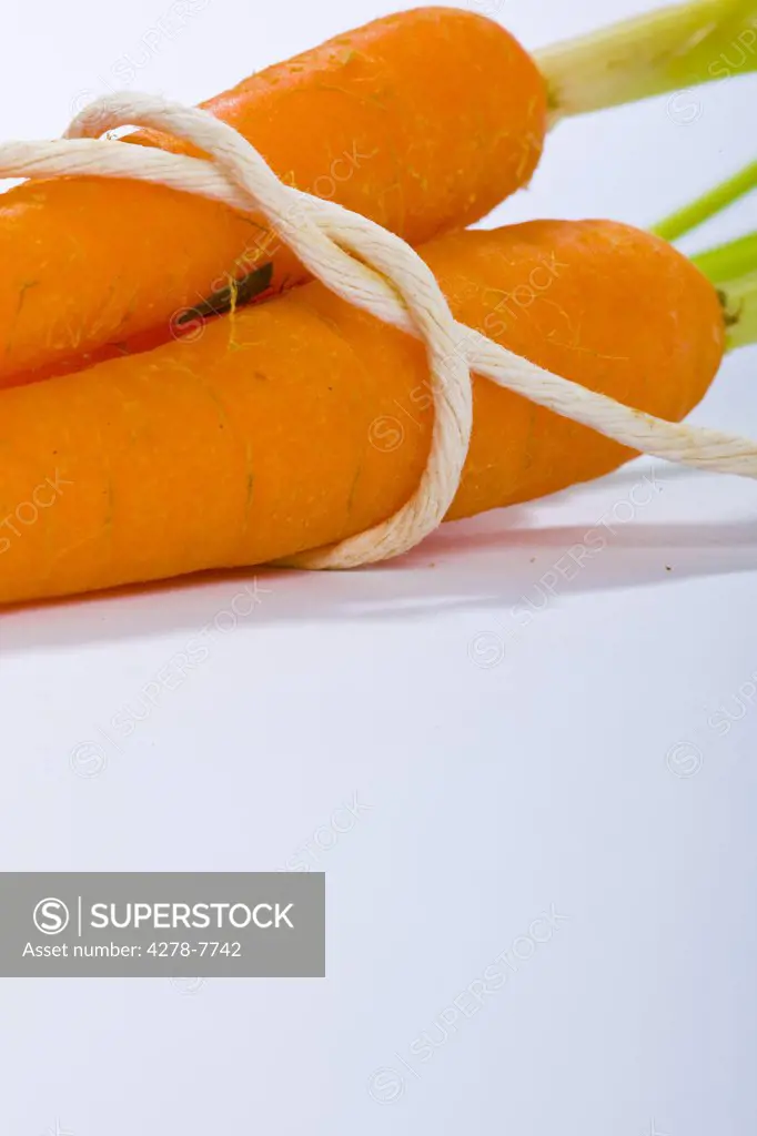 Carrots Tied up with String