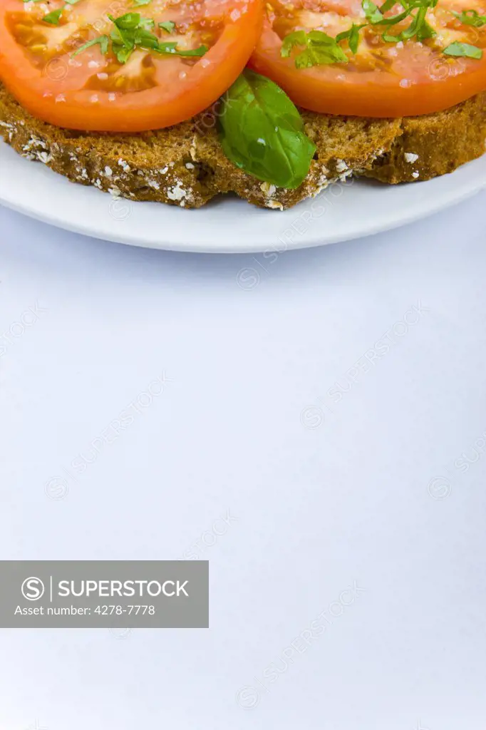 Soda Bread, Sliced Tomatoes, Basil Leaves and Rock Salt Sandwich