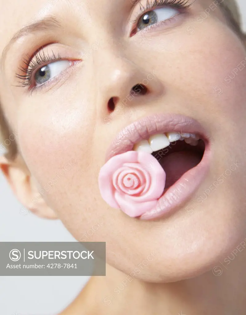 Woman Biting Pink Sugar Rose