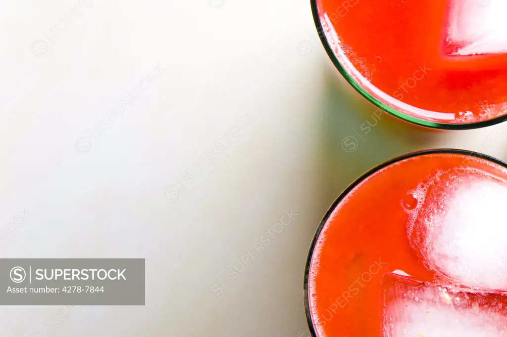 Two Glasses of Tomato Juice with Ice - High angle view