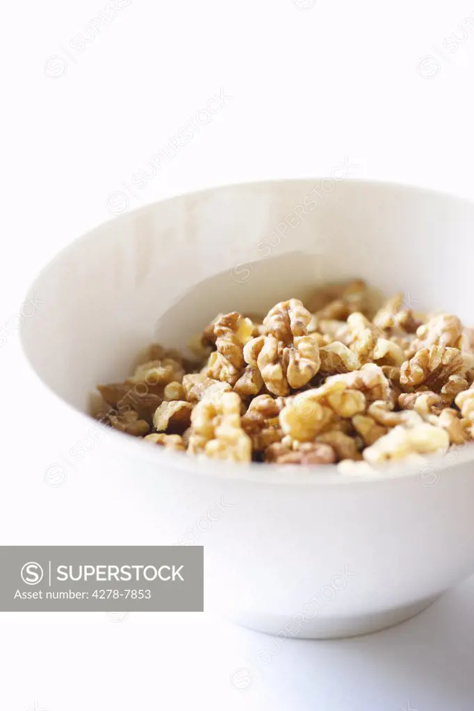 White Bowl Filled with Walnuts