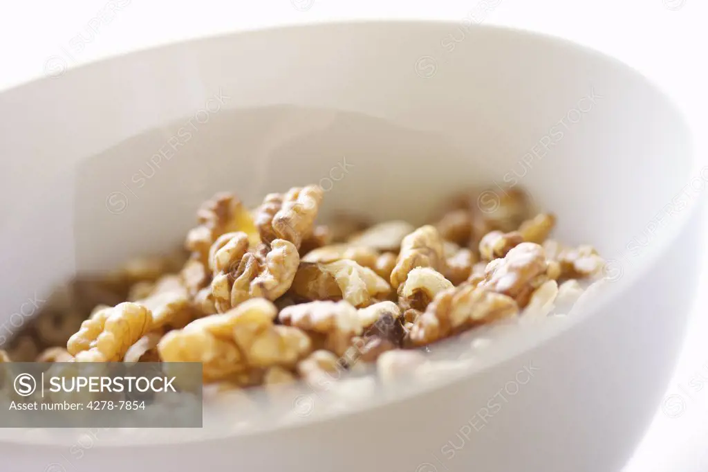 White Bowl Filled with Walnuts - Close-up view