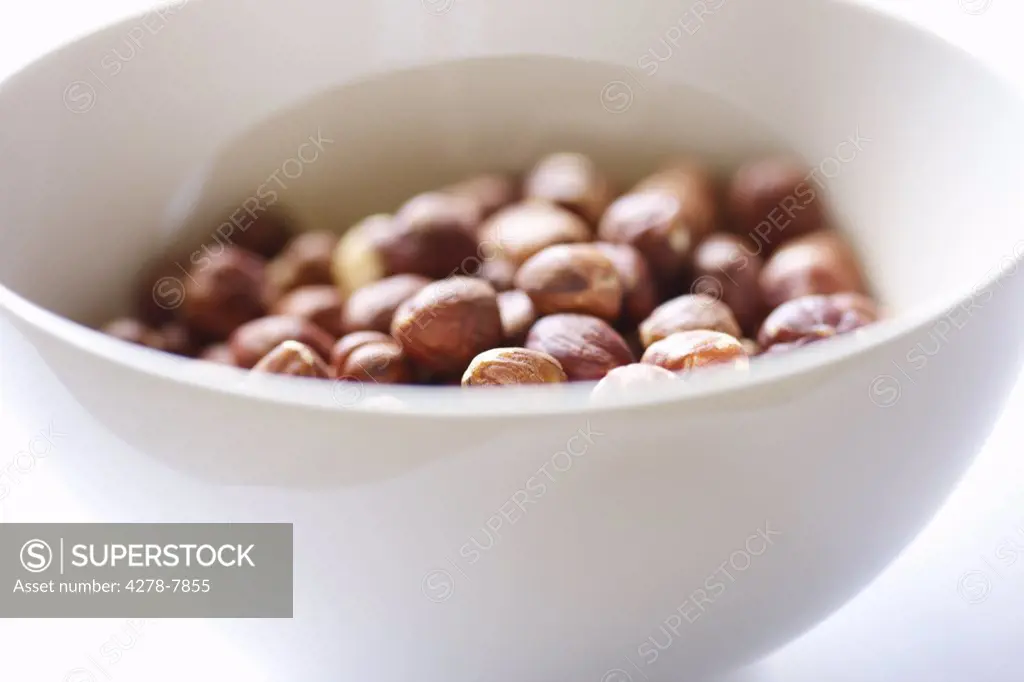 White Bowl Filled with Hazelnuts