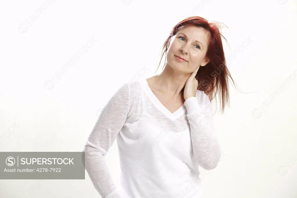 Smiling Woman with Hand on Neck