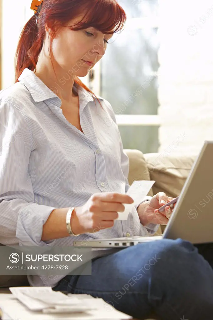 Woman Sorting out Bills