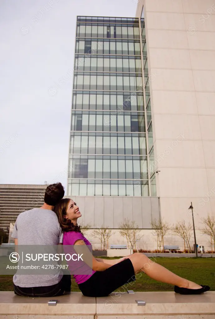 Couple Sitting Opposite Office Building