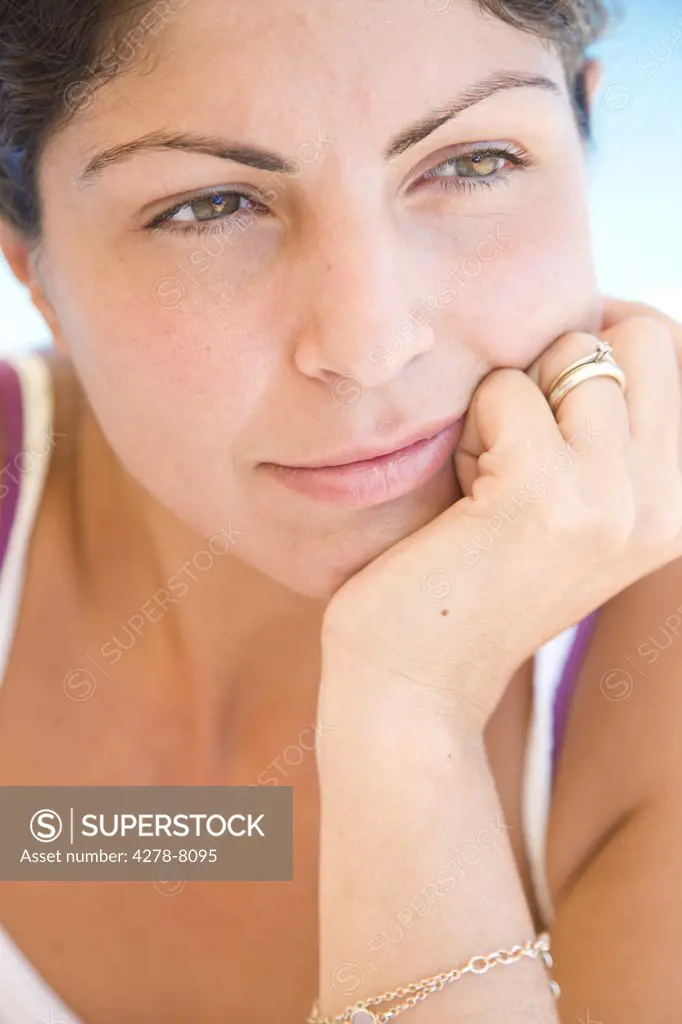 Young Woman Resting Chin on Hand