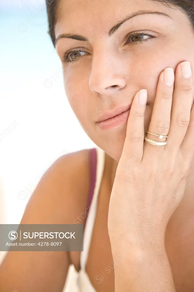 Young Woman Resting Chin on Hand