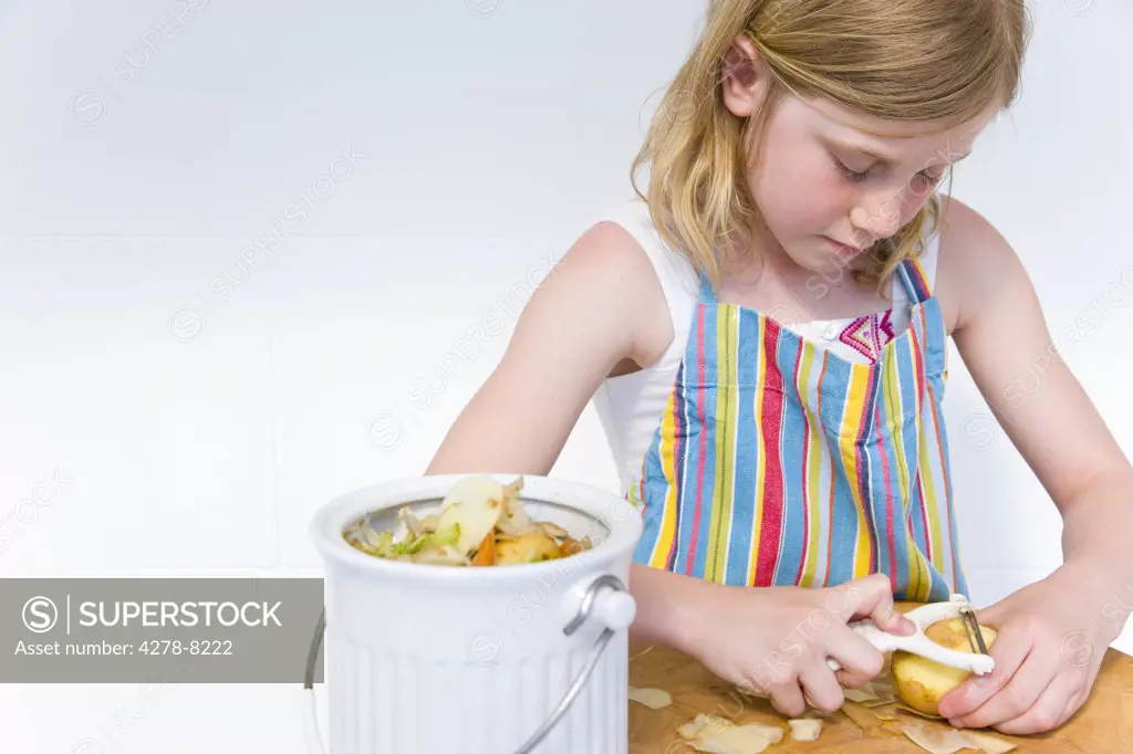 Young Girl Peeling Potatoes