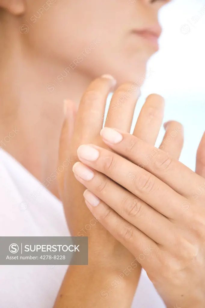 Woman Massaging Hands, Close-up view