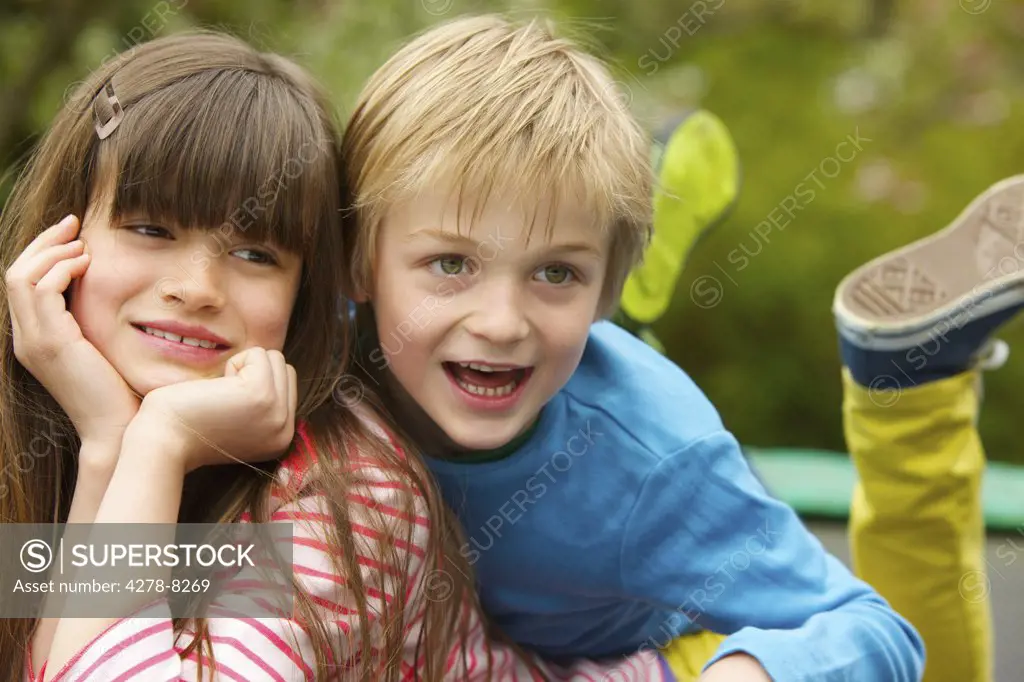 Boy and Girl Lying Outdoors