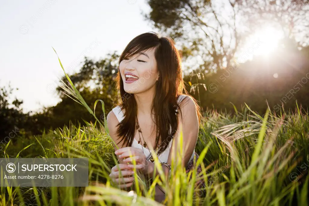 Smiling Young Woman In a Field