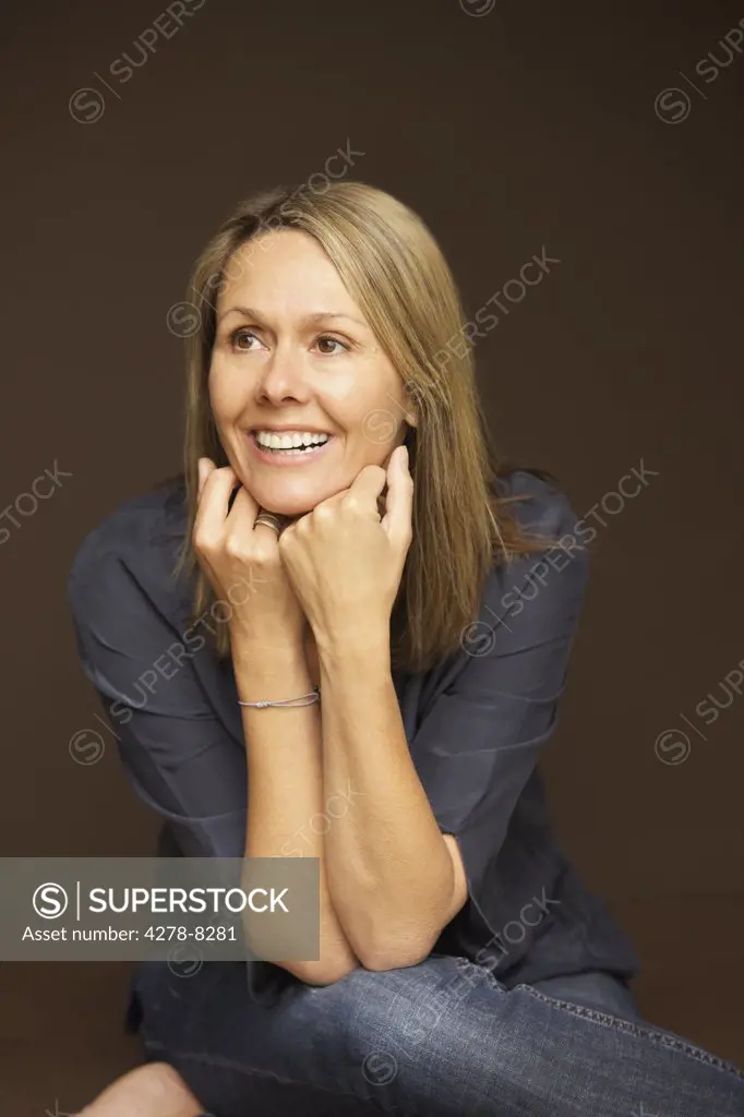Smiling Woman Leaning on Elbows