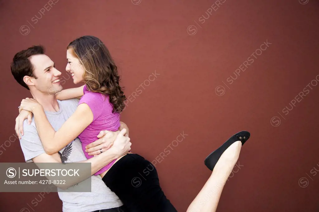 Couple Hugging and Looking at Each Other